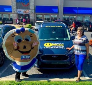 Sue with the Happy Locks decal car and iHop pancake mascot
